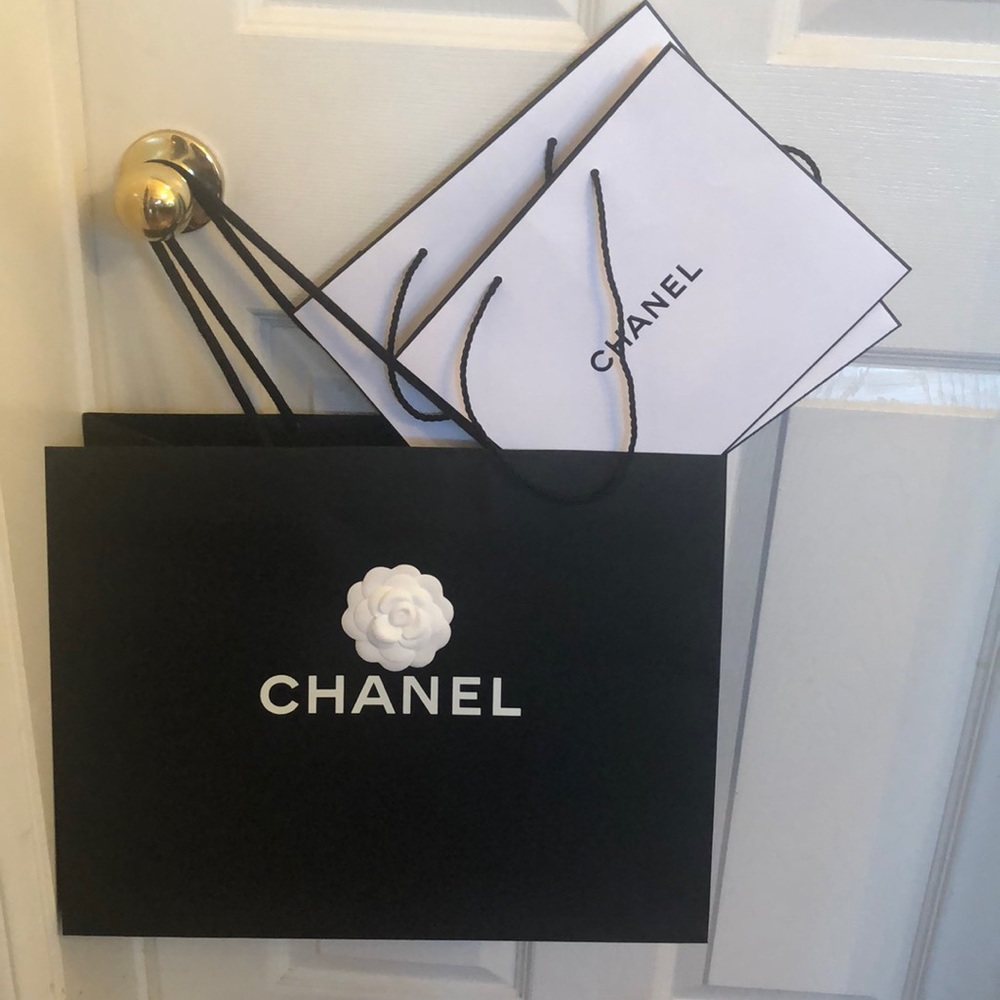 Lot of empty Chanel /Prada shopping bags